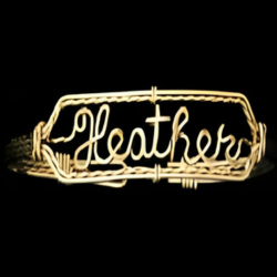 Bracelet with the word 'Heather' on a black background