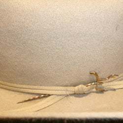 Close-up of a brand toothpick in a hat band