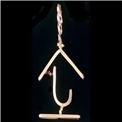 Gold-colored hook-shaped pendant on a black background